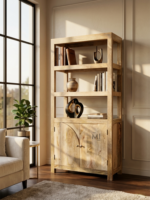 Wooden bookshelf with decorative items in a room with a large window.