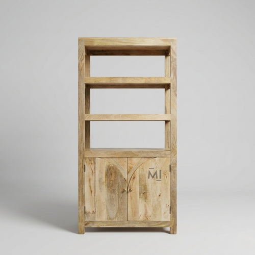 Wooden bookshelf with a door on a gray background