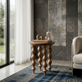 Wooden side table with decorative items in a living room setting
