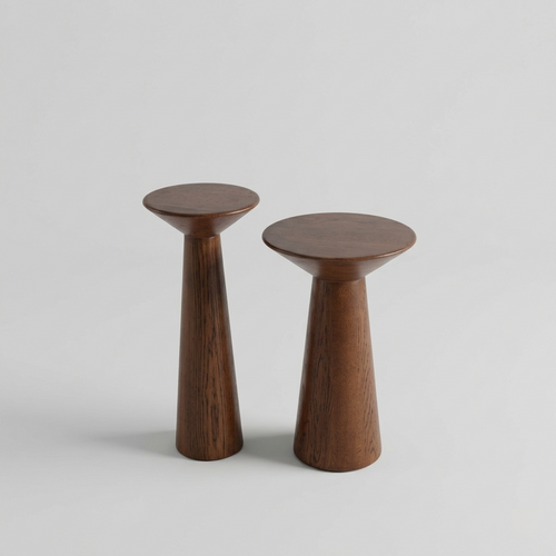 Two wooden stools on a light gray background