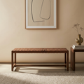 Modern solid wood bench with handwoven leather strap seat in walnut finish for contemporary interiors