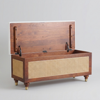 Handcrafted wooden storage trunk with woven cane panel detailing