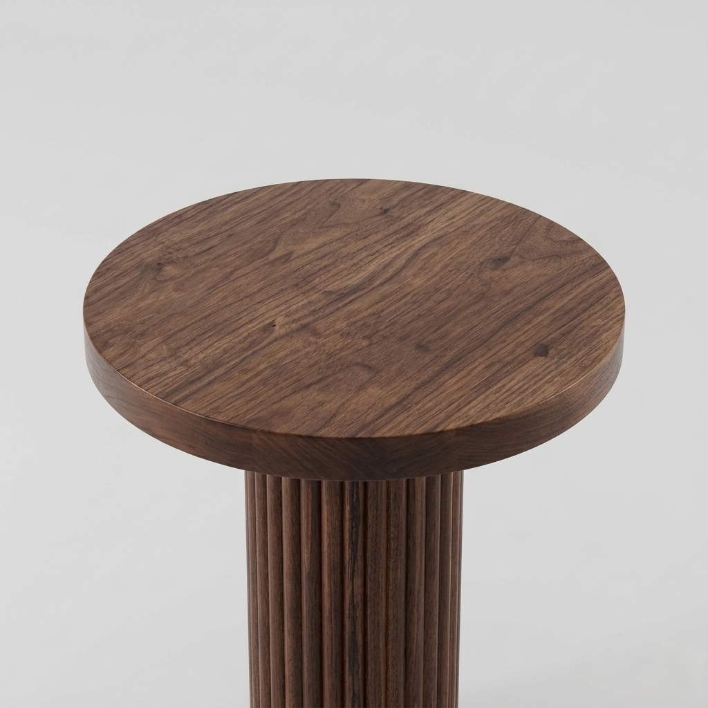 Wooden stool with a round top and cylindrical base on a light gray background