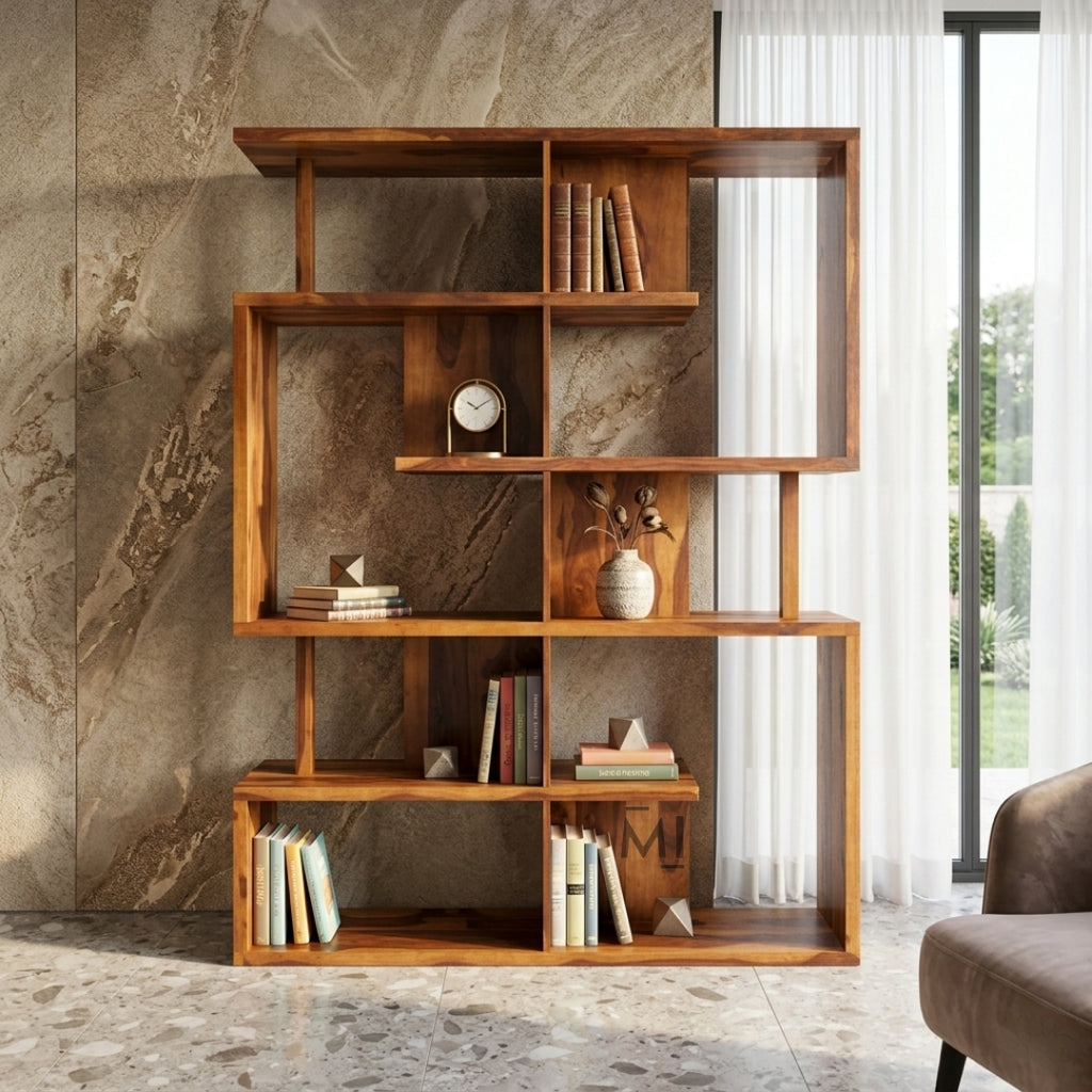 Wooden bookshelf with books and decorative items against a stone wall.