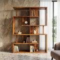 Wooden bookshelf with books and decorative items against a stone wall.