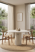 Round white marble dining table with fluted pedestal base