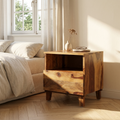 Minimalist solid wood bedside table with open shelf and storage drawer beside a modern bedroom bed